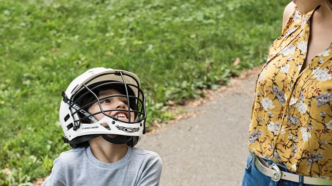 Mother takes son on bike ride in the park