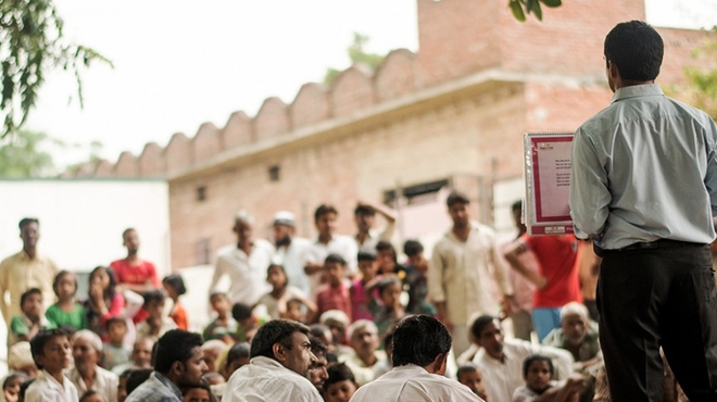 Health educator Chankey Kumar addresses people in the northern Indian village of Mulehra