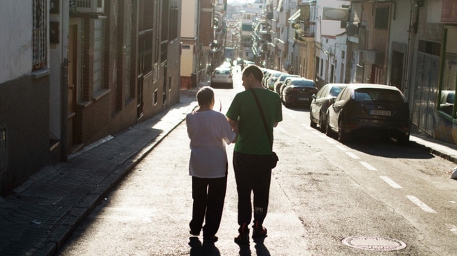 Juan Pedro García Hernández and his mother go for a walk in their neighborhood.
