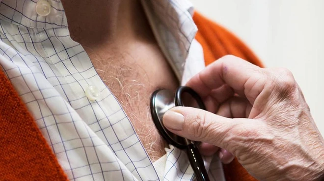 Heart failure patient receives care from his doctor