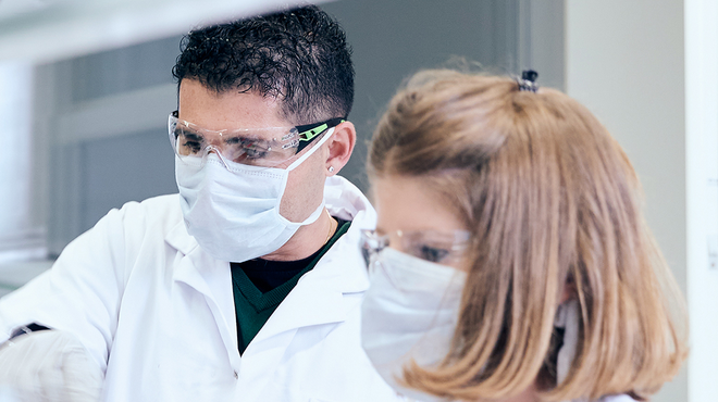 Scientists working together in a biomedical research lab.