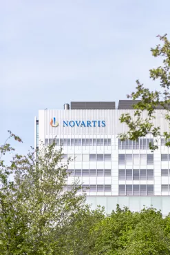 View of the Novartis logo on the Banting 1 building from Park South, Novartis Campus Basel (vertical)
