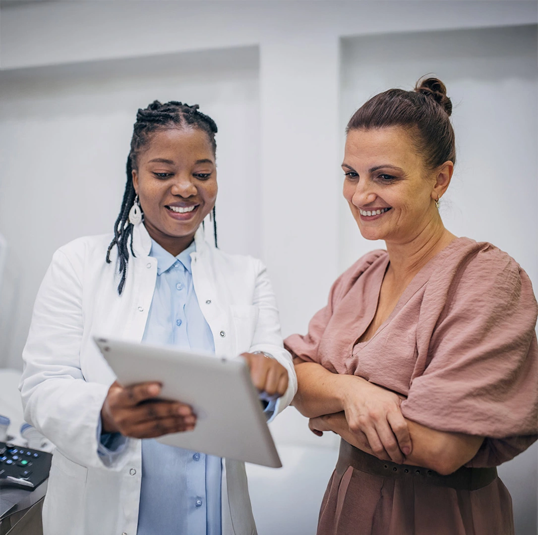 Doctor and patient discussing medical results on an iPad