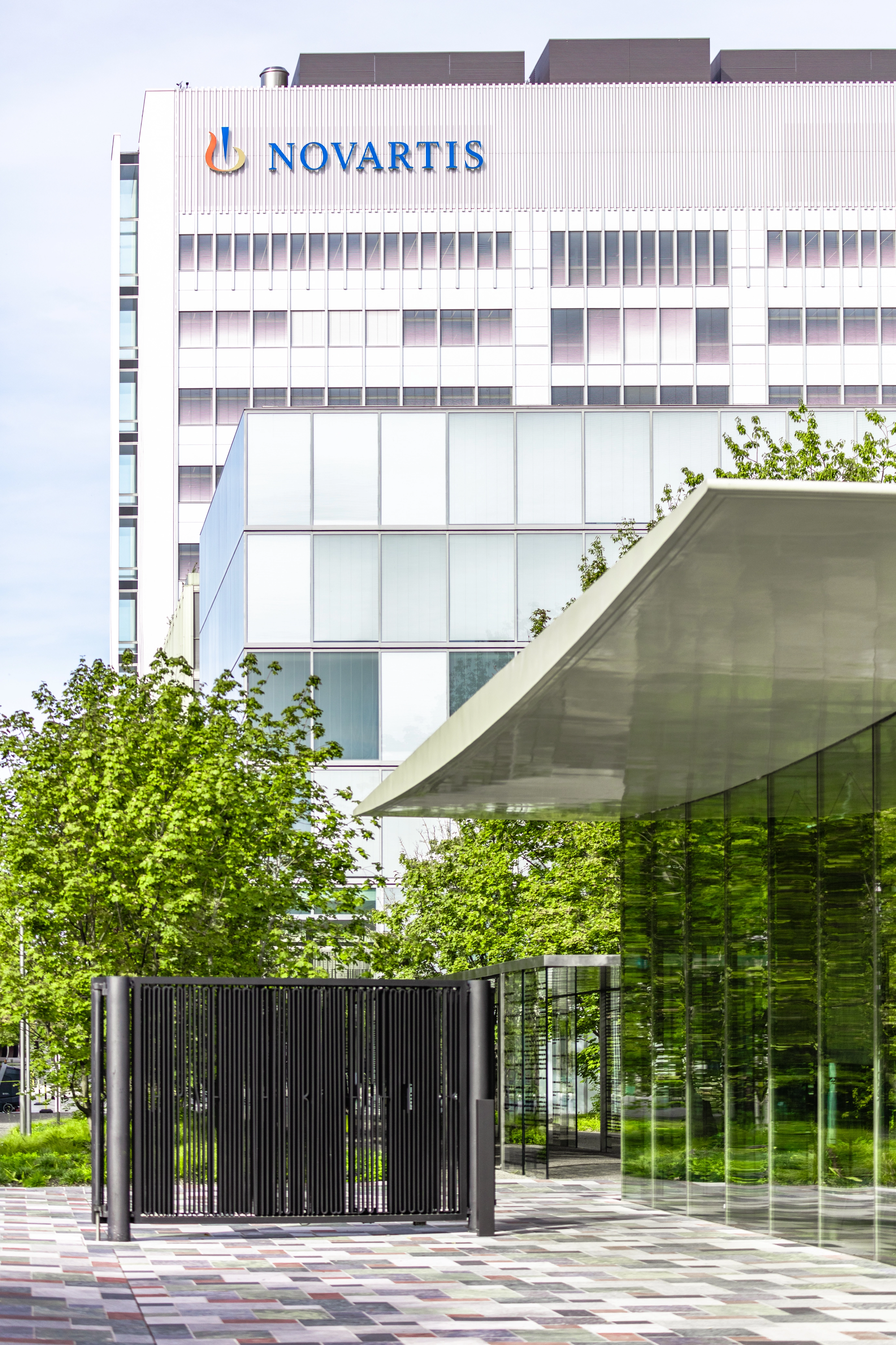 View of the Novartis logo on the Banting 1 building from the main gate, Novartis Campus Basel (vertical)