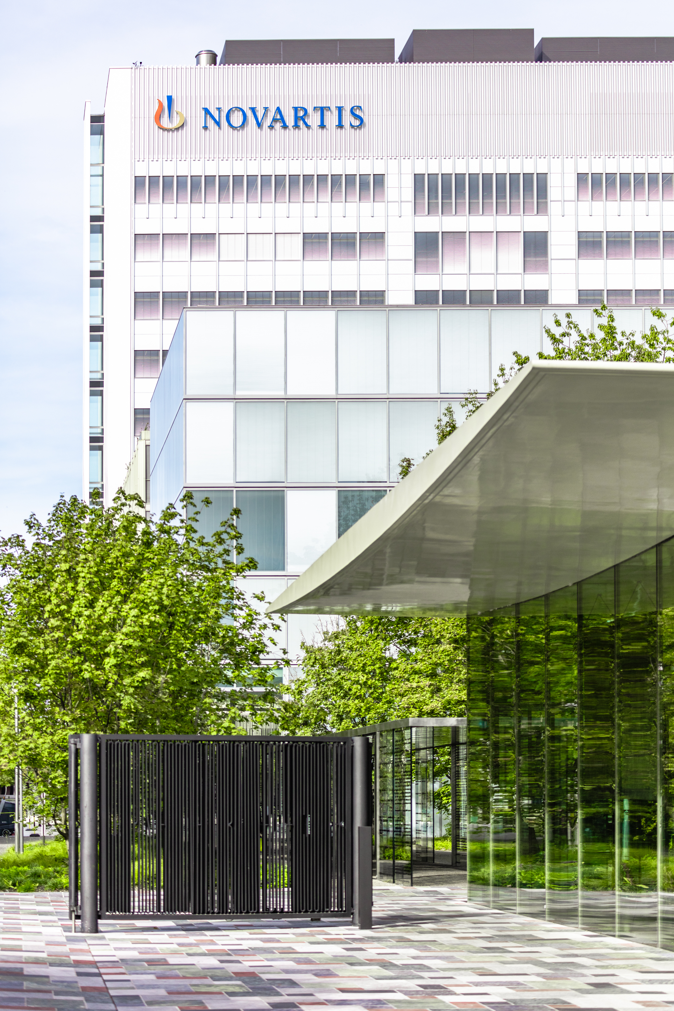 View of the Novartis logo on the Banting 1 building from the main gate, Novartis Campus Basel (vertical)