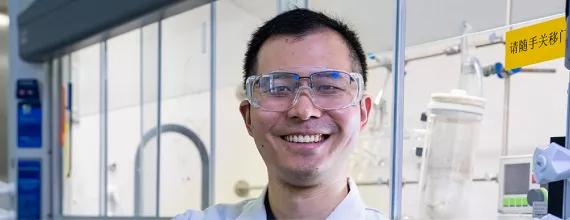 Scientist in lab smiling