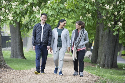 Friends walking in park