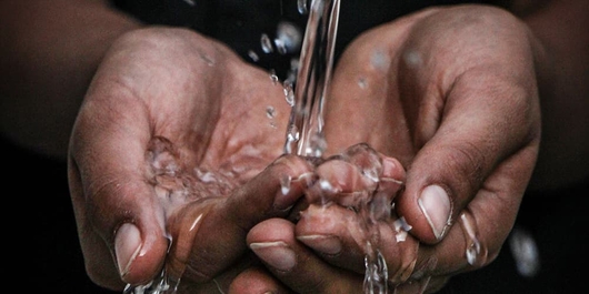 Water pouring into hands