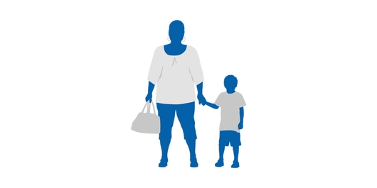 A woman holding hand of a child