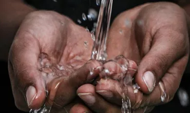 Water pouring into hands