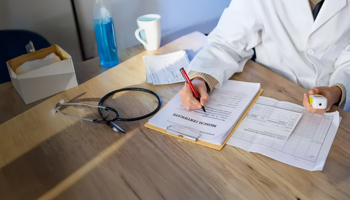 healthcare professional signing papers