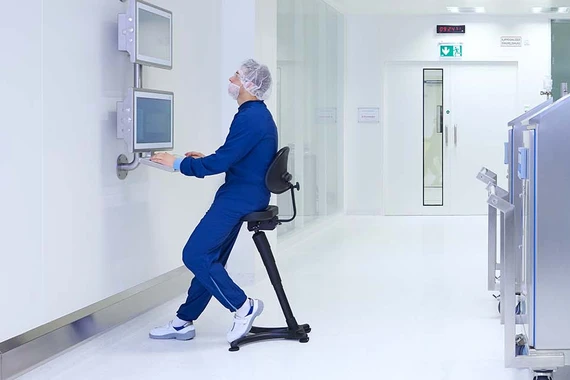 A production specialist working on a computer