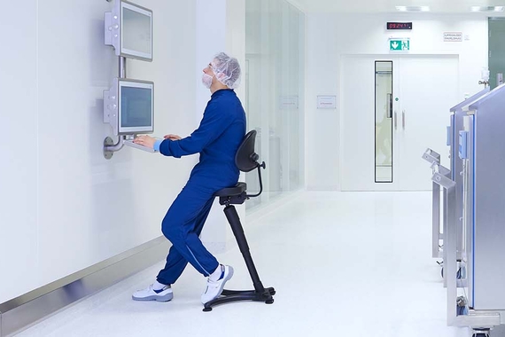 A production specialist working on a computer