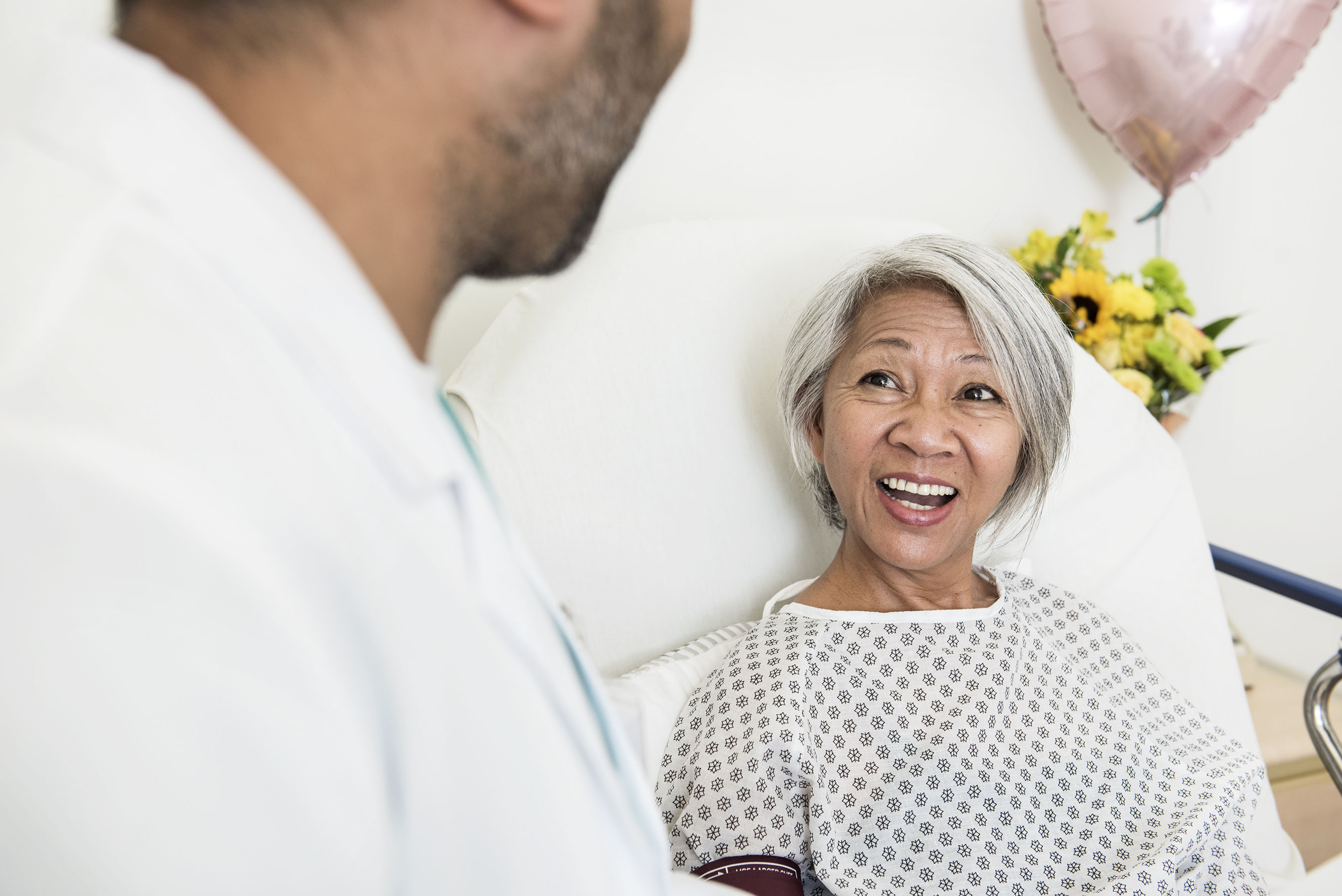Patient smiling at doctor image