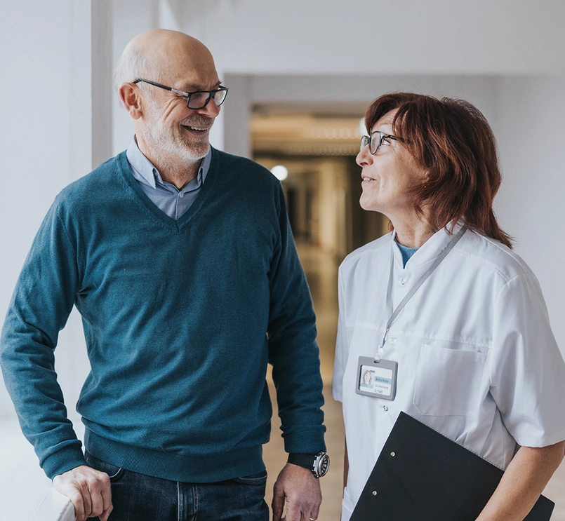 Doctor and patient talking in hallway