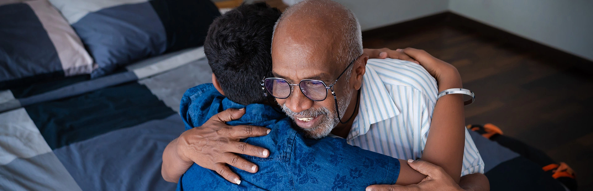 Grandfather hugging his grandson