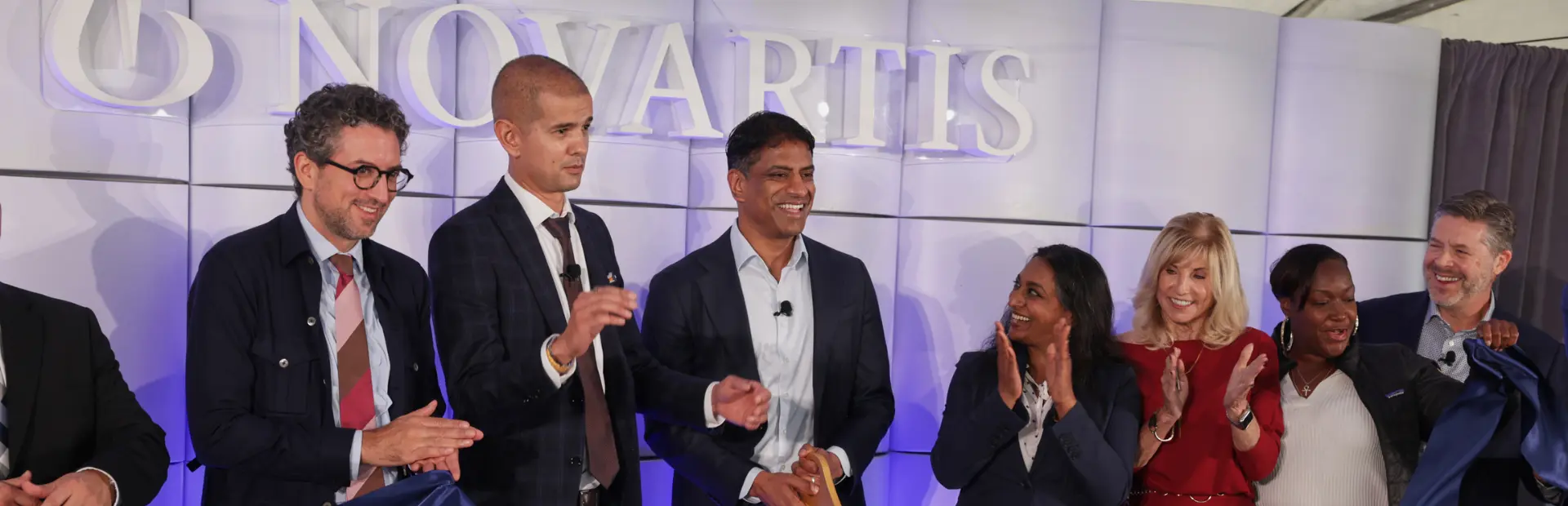 Novartis CEO Vas Narasimhan cuts the ribbon alongside others at the Carlsbad site opening ceremony.
