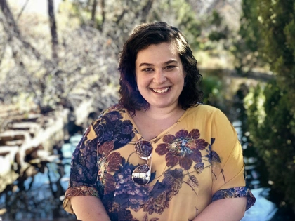 HS patient Katy, smiling at the camera 