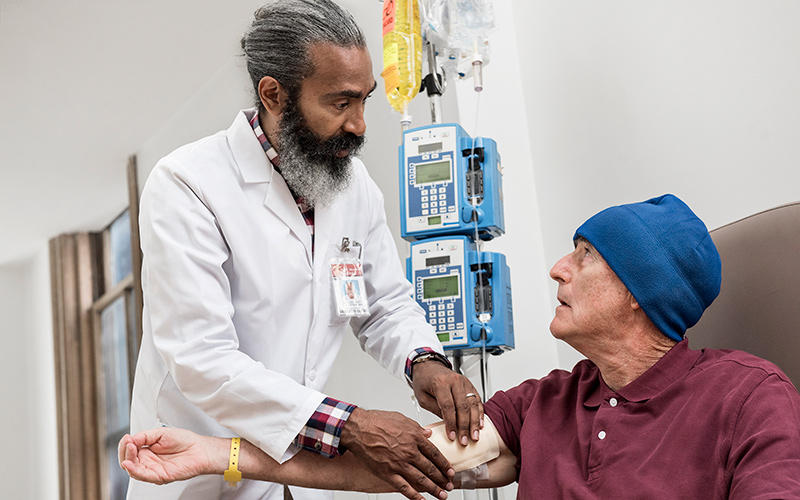 applying bandage on arm of older person