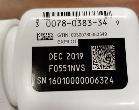 Product label displaying GTIN, LOT, EXP, SN, and Authorized Trading Partner information.