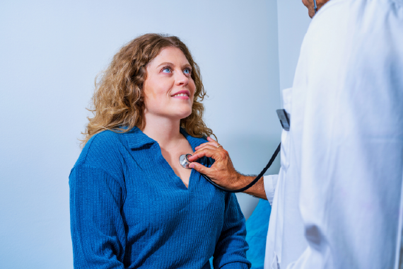 Women patient getting examined by doctor 