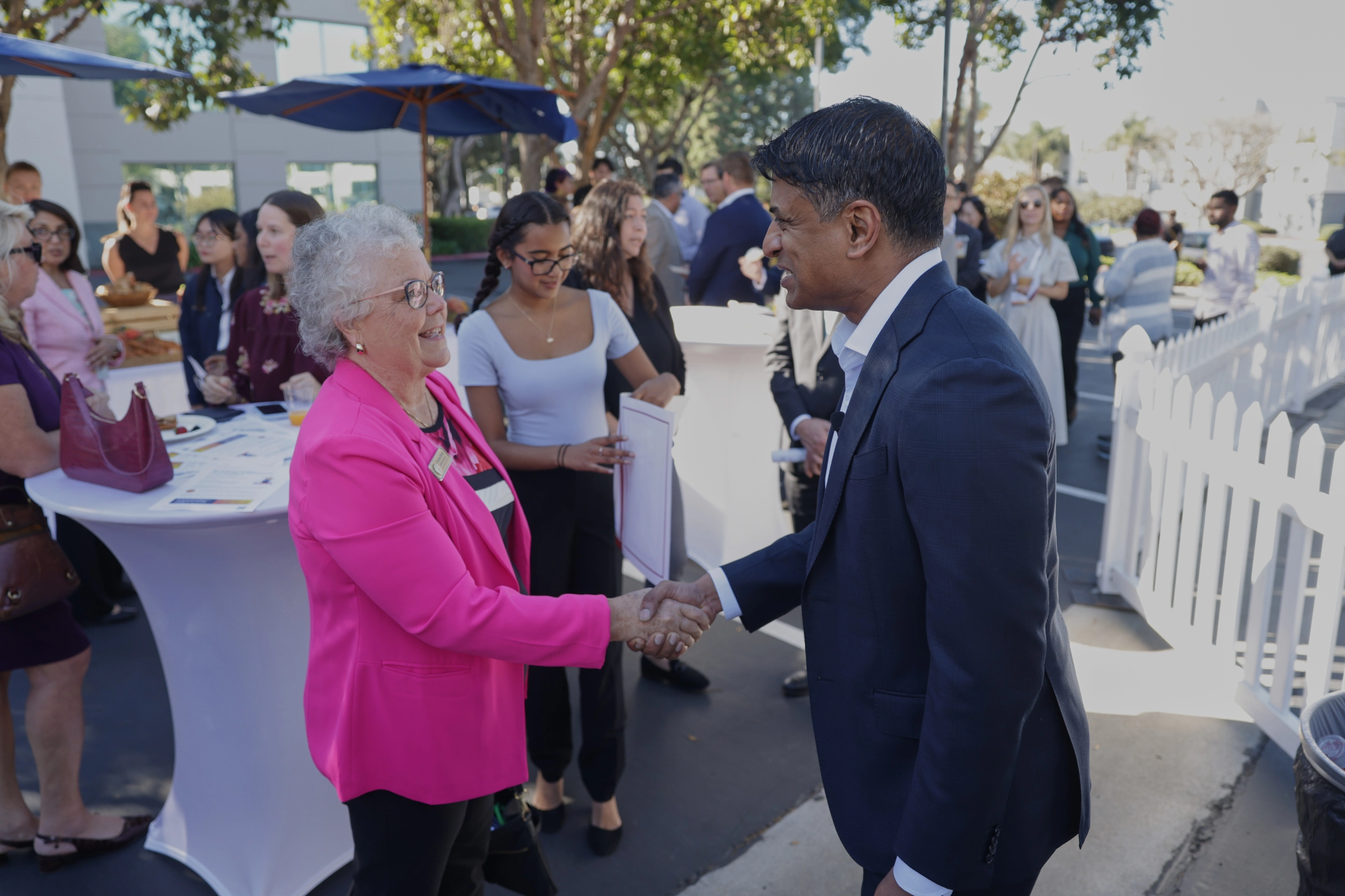 Novartis CEO Vas Narasimham greeting an attendee at the launch of the Carlsbad manufacturing site.