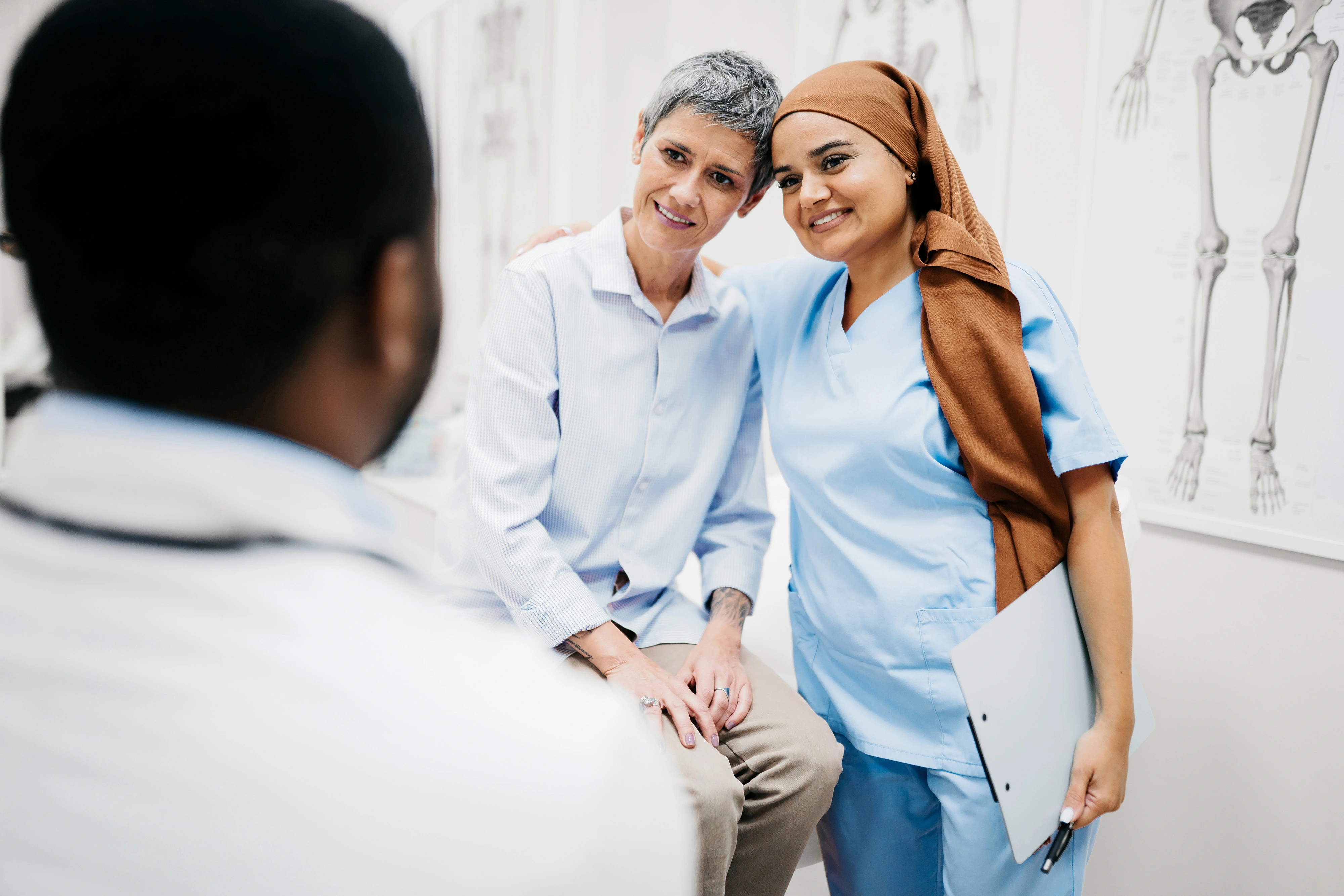 Nurse and patient exchange a warm moment. Featured in a story about how Novartis is working to bring hope to those with autoimmune diseases.