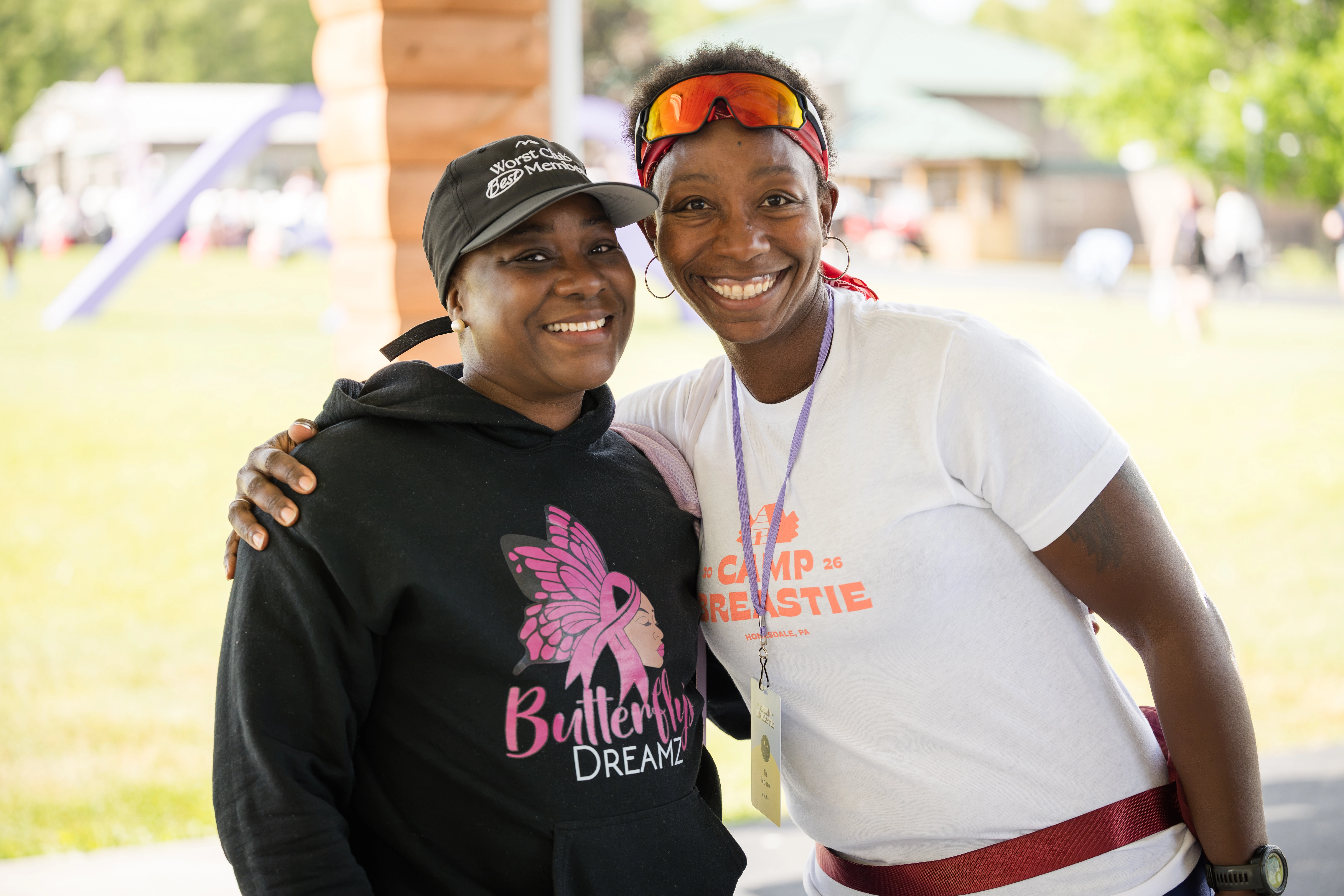 Two women smiling together at Camp Breastie.