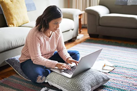 Woman working from home on her computer. credit : Coursera