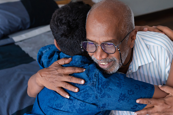 Grandfather hugging his grandson