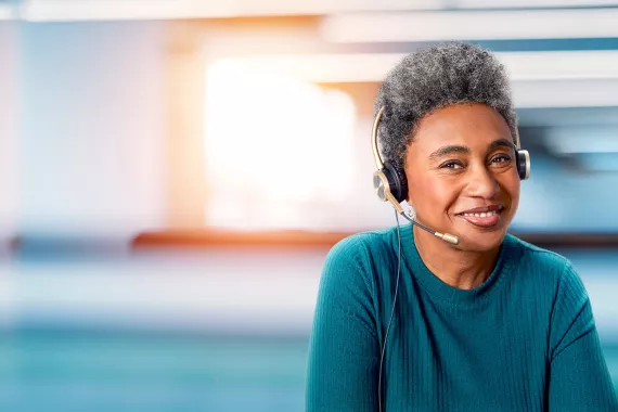Woman with headset in a call center setting