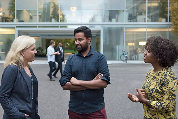 Novartis employees speaking together 