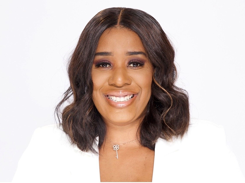 Close-up view of ShantaQuilette as she smiles for the camera