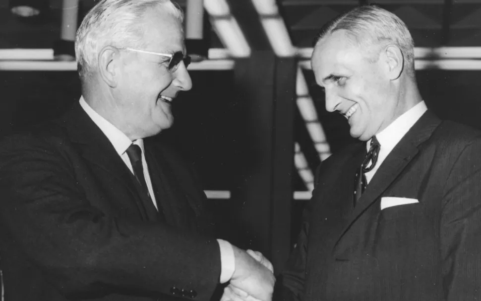 Geigy President Louis von Planta and CIBA President Robert Käppeli shake hands to conclude the merger of CIBA-GEIGY in 1970.