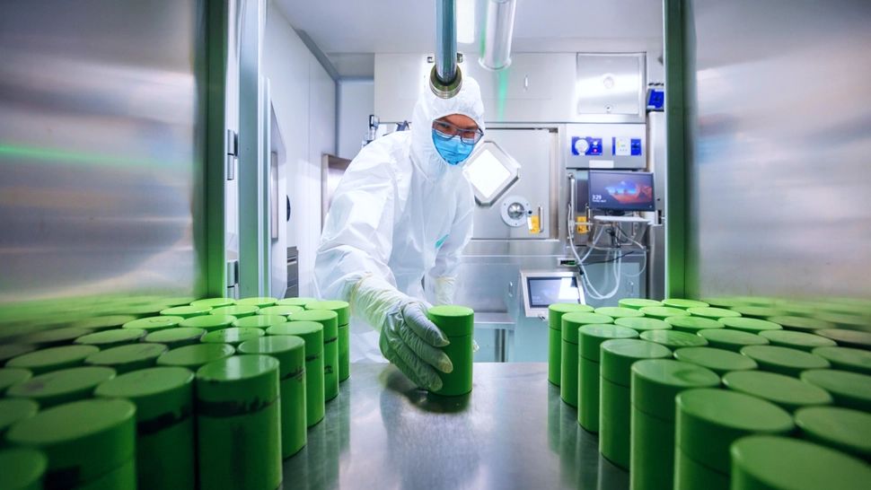 Man working with doses of radioligand medicine