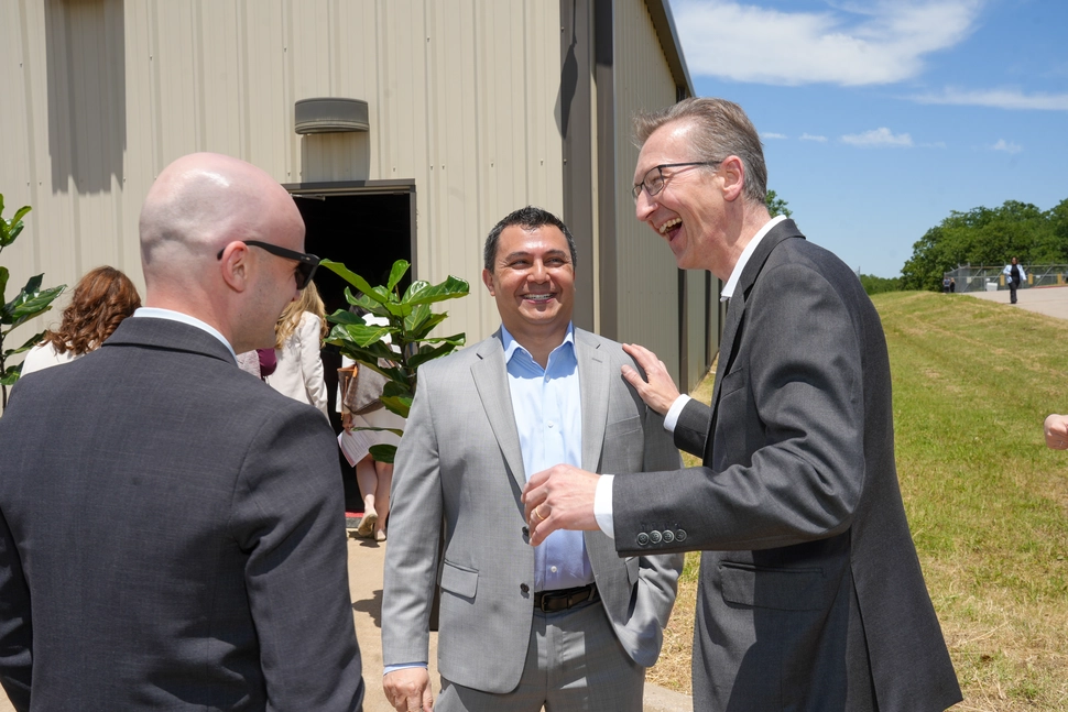Steffen Lang, President, Operations at Novartis (right), connects with Global and US RLT leadership before the groundbreaking event in Denton, Texas.