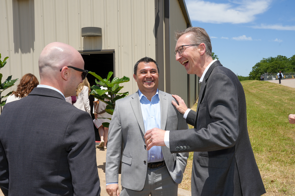 Steffen Lang, President, Operations at Novartis (right), connects with Global and US RLT leadership before the groundbreaking event in Denton, Texas.