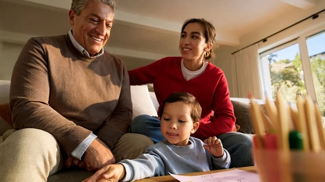 Family engaging in creative activity at home