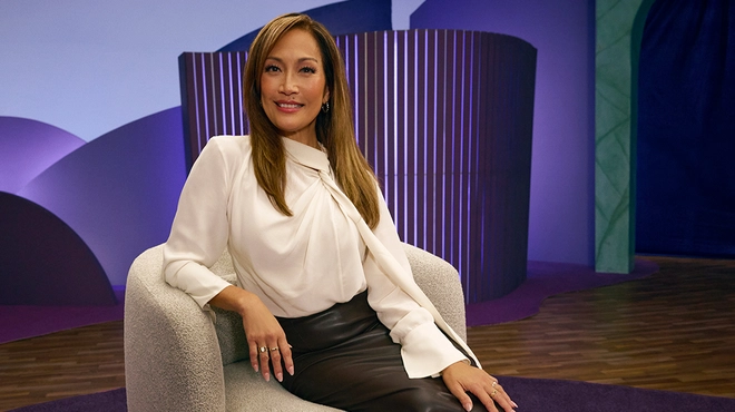 Carrie Ann Inaba smiling on set of SJÖUT for Sjögren's disease education campaign.