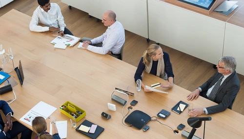 A photo of people in a meeting hall