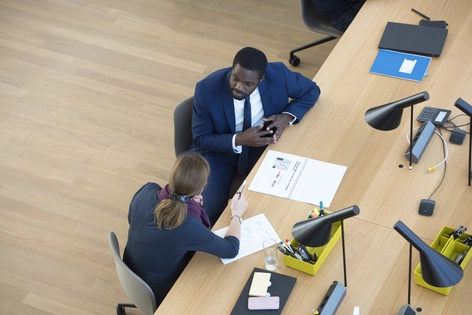 Woman and man sitting at desk